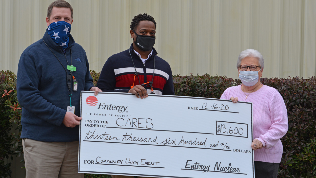 Grand Gulf provided a $13,600 grant to CARES in support  of its Celebrating Community Unity Christmas Event.  Pictured left to right: GMPO Brad Wertz, RAPID Rob Melton  and CARES President Linda Ory